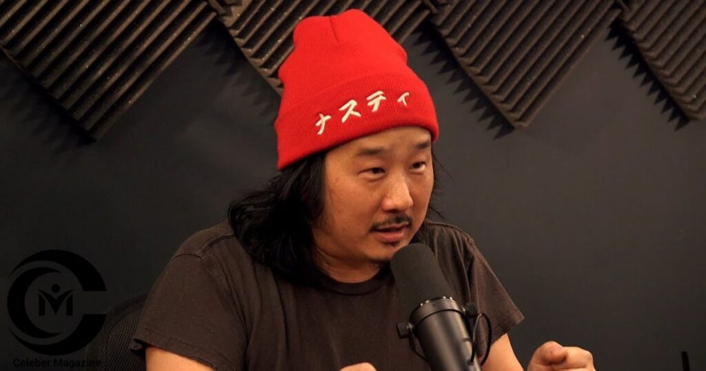 Bobby Lee speaking into a microphone during a podcast.