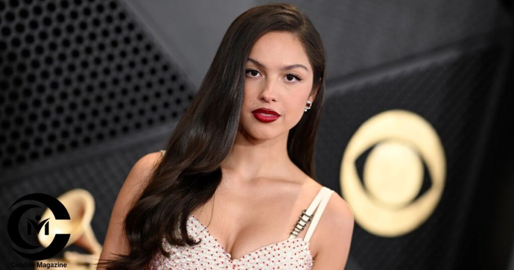 Olivia Rodrigo posing at a red carpet event